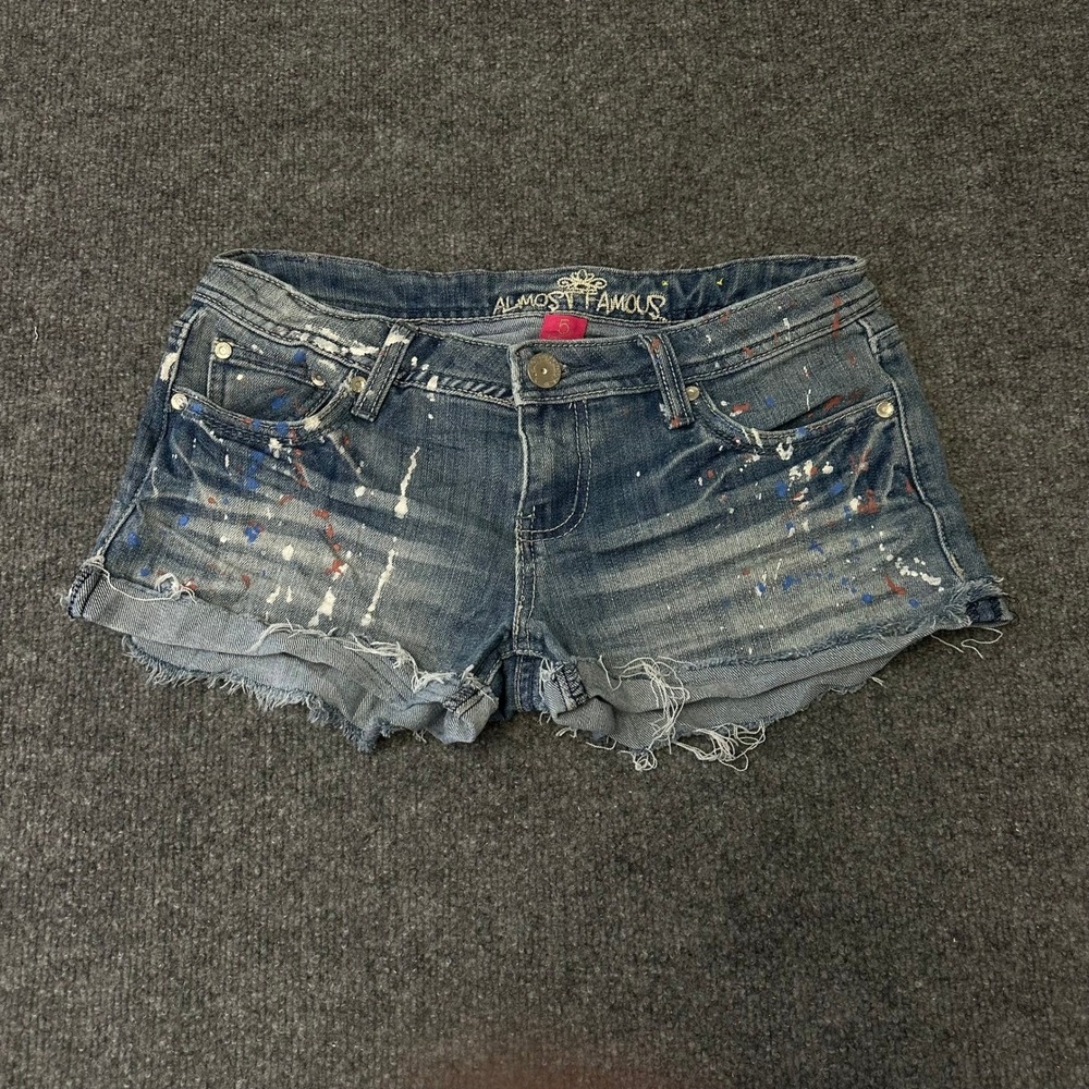 Almost Famous Denim Shorts Womens Size 5 Blue Paint Splatter Raw Hem Cutoff Mini